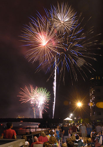 Beautiful Fireworks Display at Night on Rooftop Provided by Spectrum Pyrotechnics 